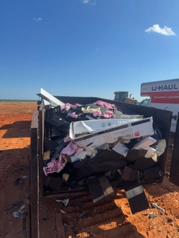 Driveway cleanout — loaded trailer