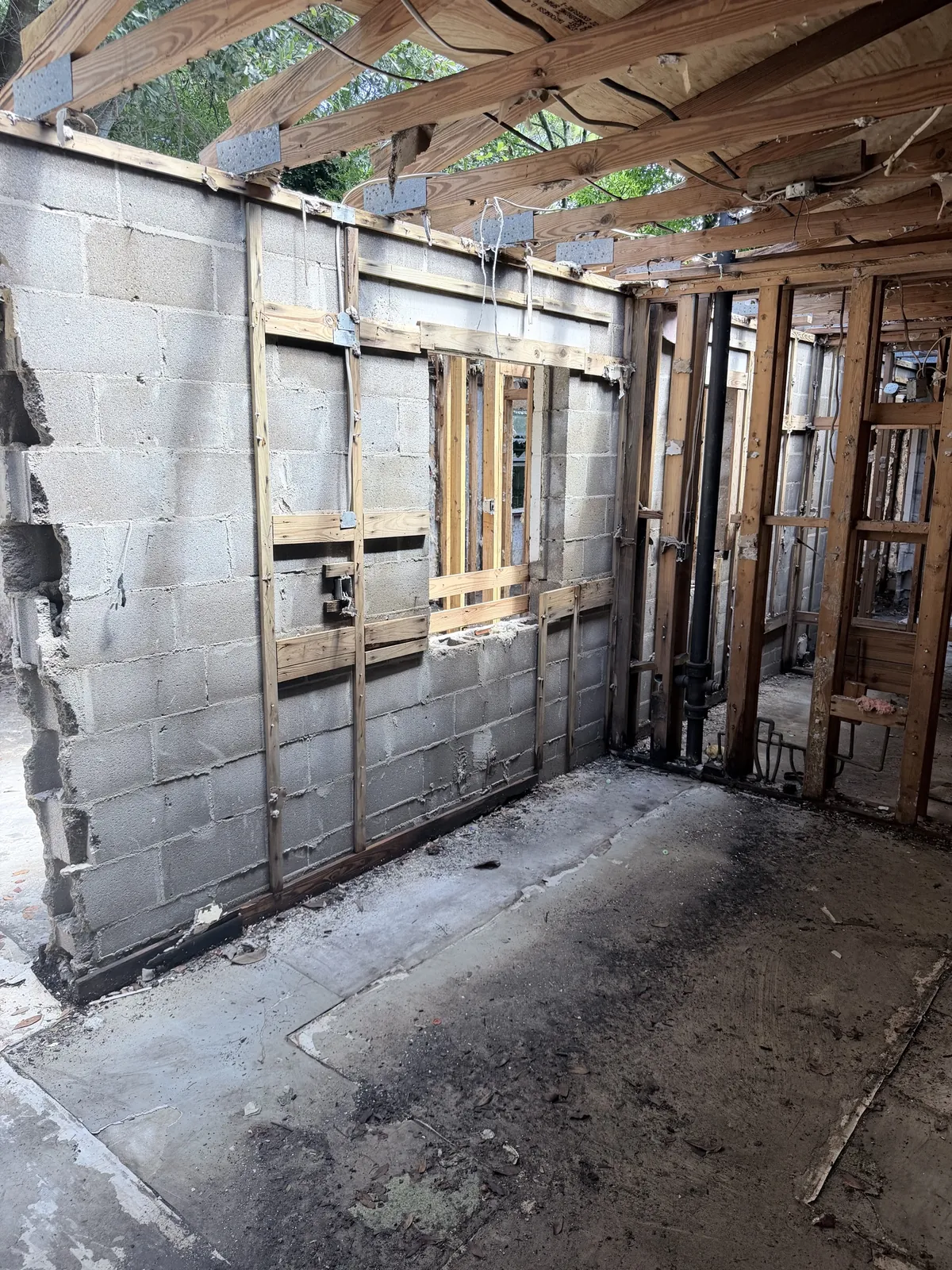 Exposed framing during a selective demolition project in Northwest Florida