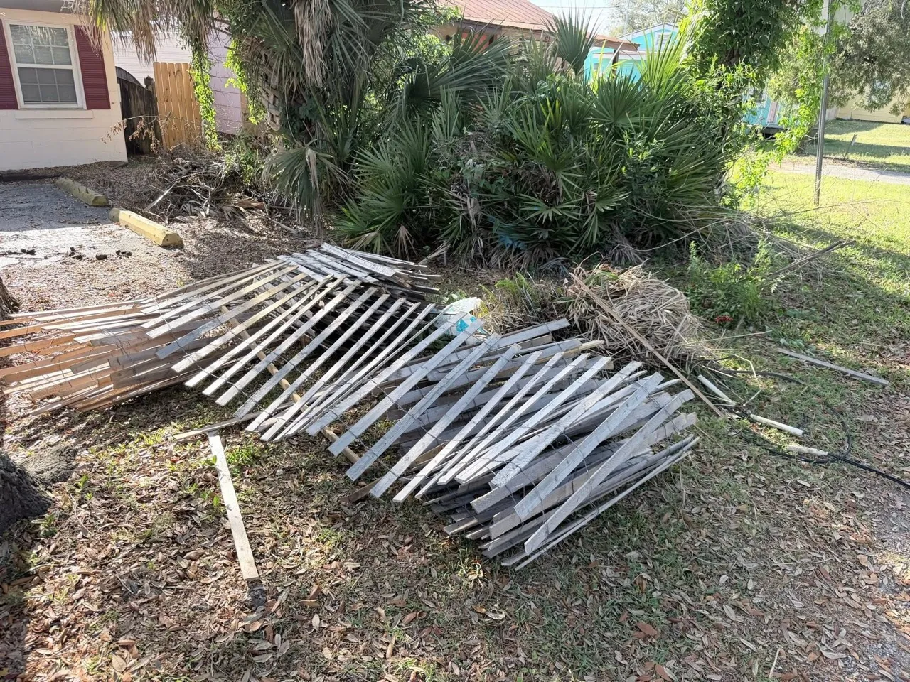 Fence material ready for demolition debris removal